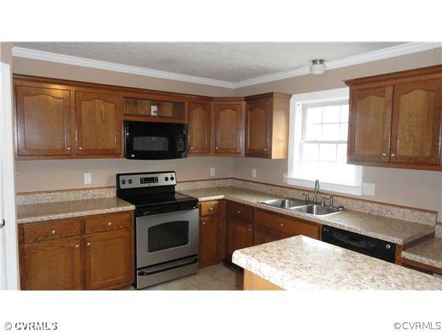 7295 Railroad Bed Road Carson, VA 23830 - Photo 5 of 12 a kitchen with a sink stove and microwave