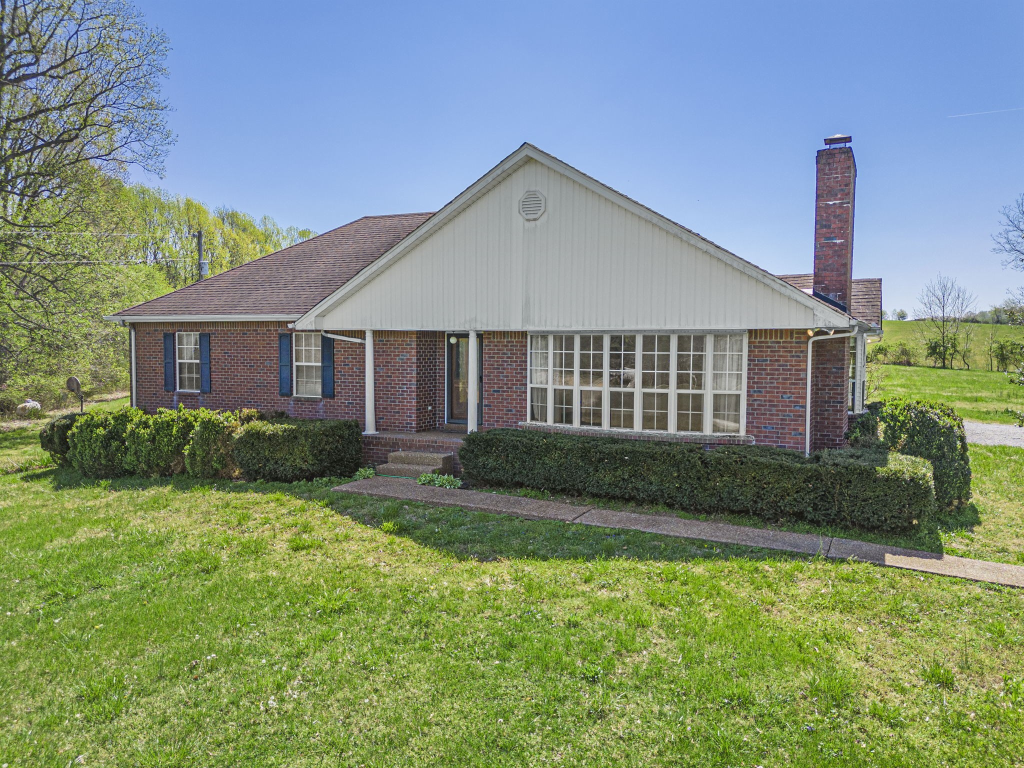 9139 Owens Chapel Road Springfield, TN 37172 - Photo 11 of 29 a front view of a house with a yard and garage