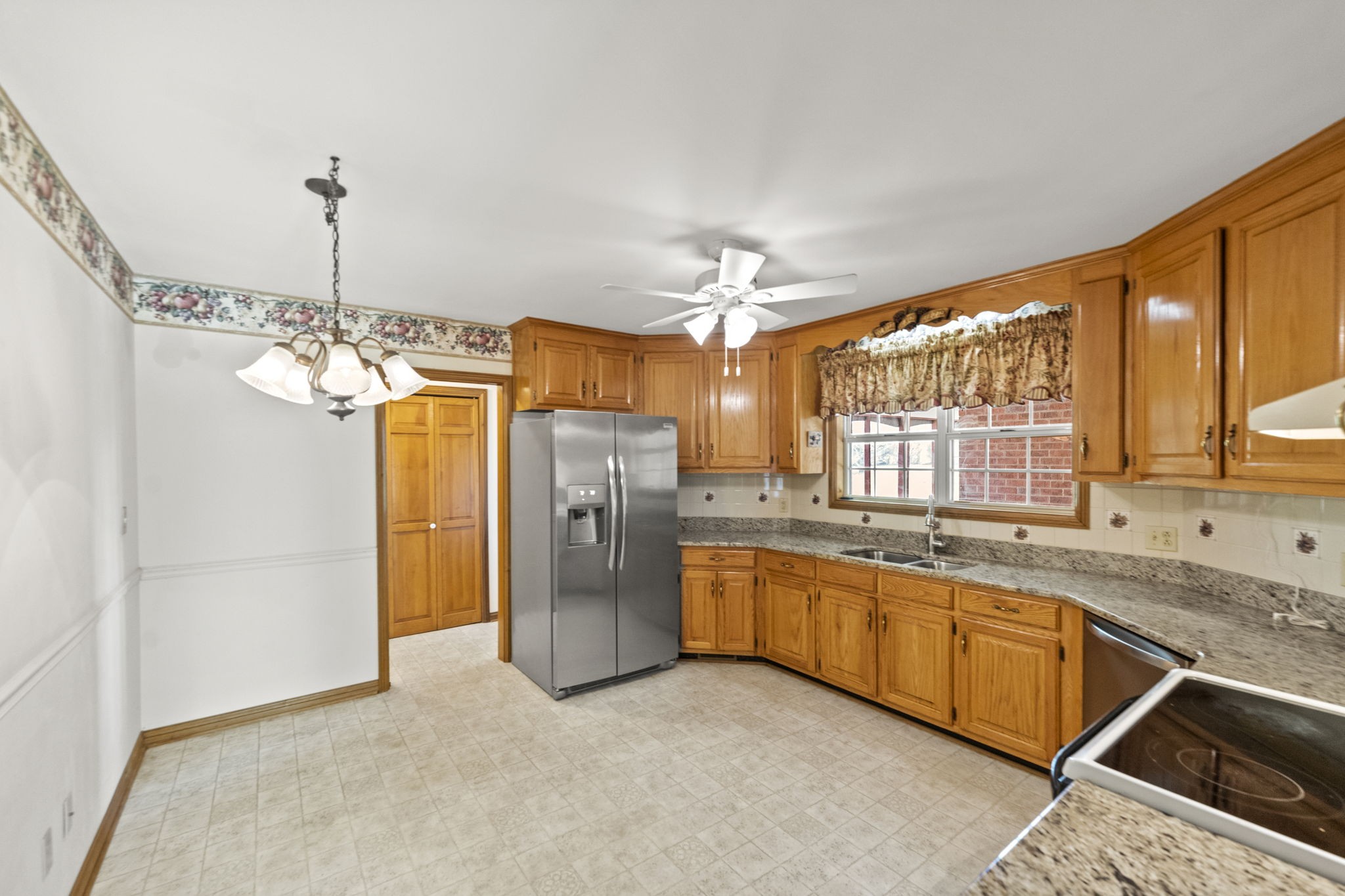 9139 Owens Chapel Road Springfield, TN 37172 - Photo 15 of 29 a kitchen with center island and stainless steel appliances