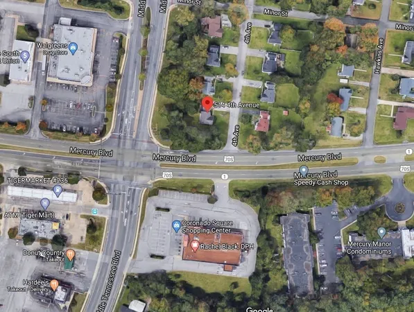 an aerial view of houses with outdoor space