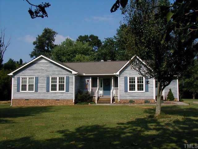 13010 Meadow Ridge Drive Rougemont, NC 27572 - Photo 1 of 1 a front view of a house with a garden
