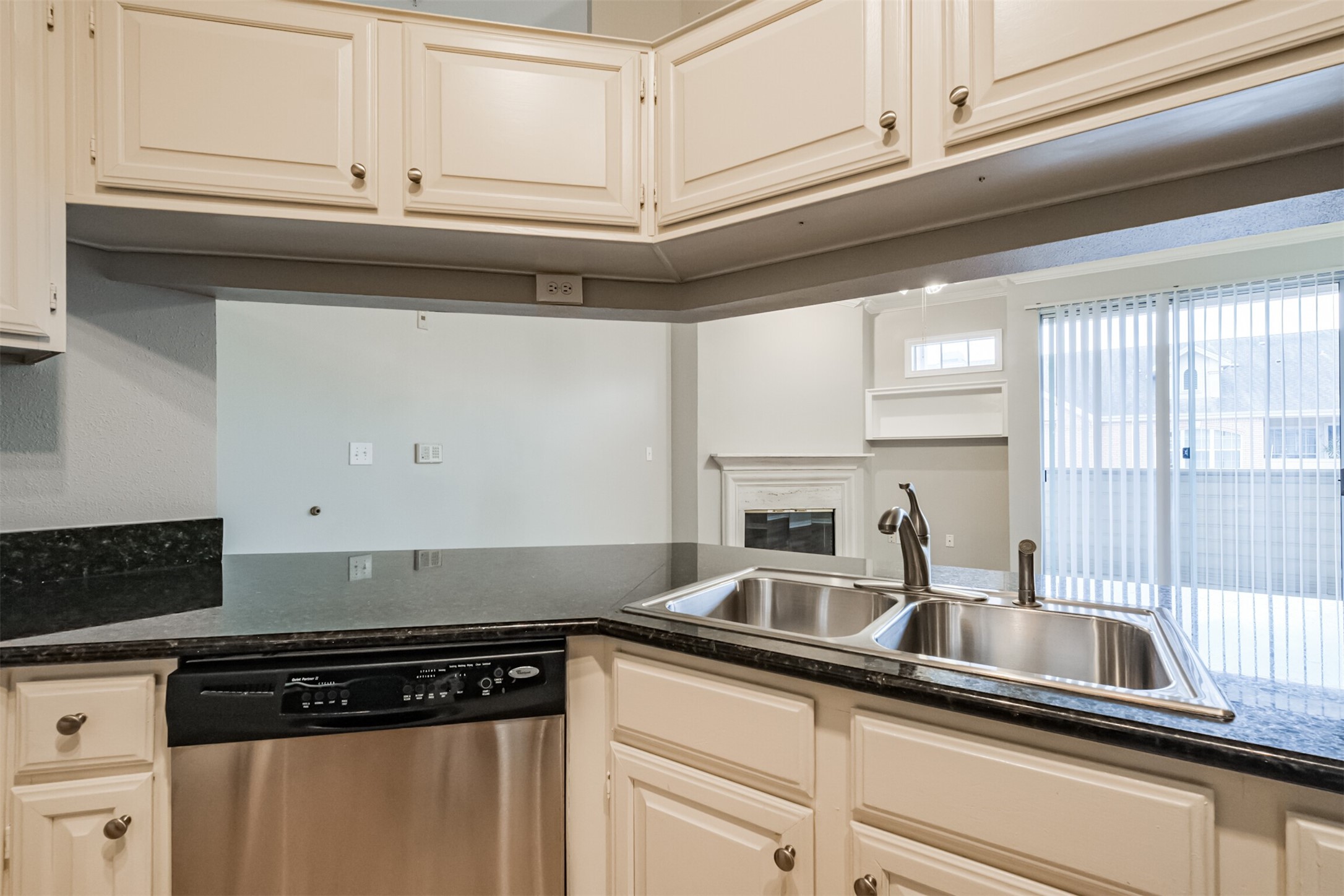 2111 Welch Street, Unit B304 Houston, TX 77019 - Photo 13 of 37 a kitchen with stainless steel appliances granite countertop a sink and white cabinets