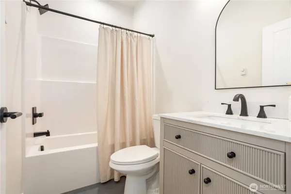 a bathroom with a sink a toilet and a bathtub