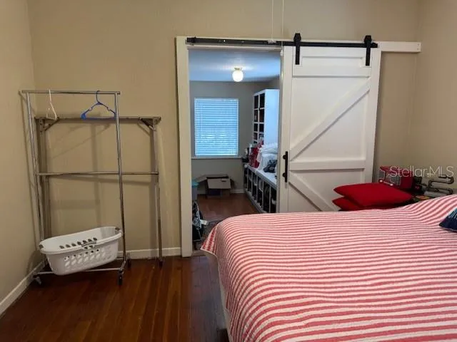 a bedroom with a bed and a table