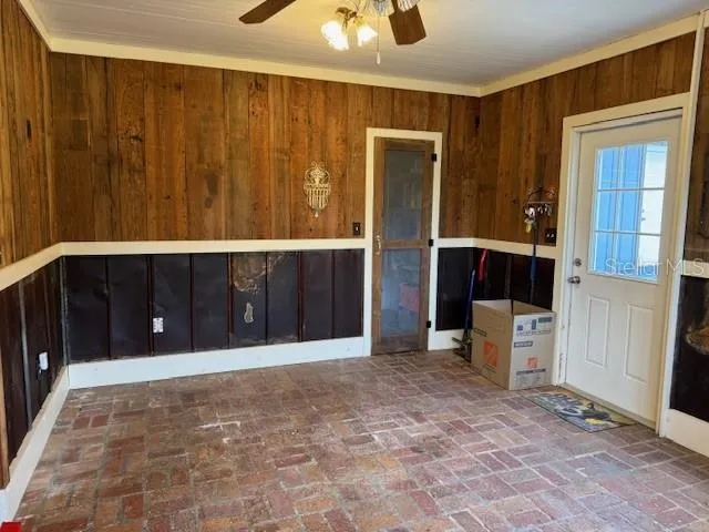 a view of an empty room with a cabinet