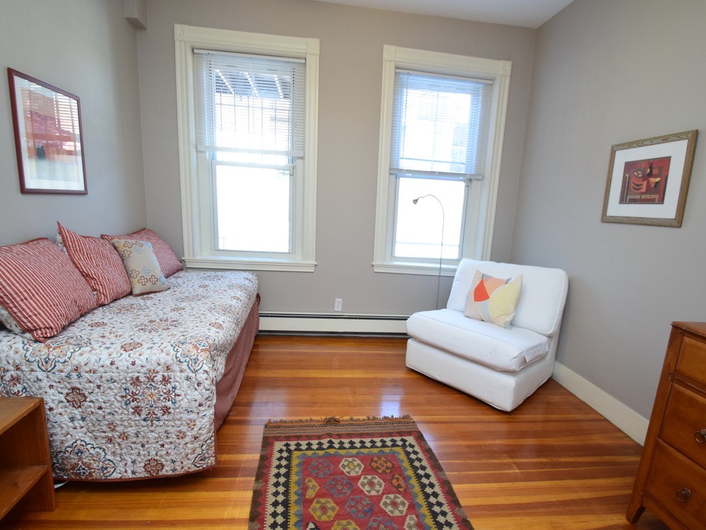 17 Strathmore Road, Unit 1 Brookline, MA 02445 - Photo 14 of 19 a living room with furniture and a rug