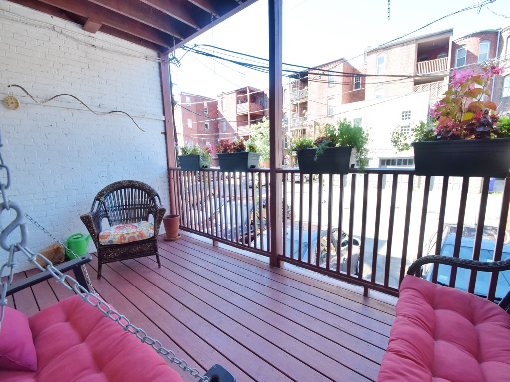 17 Strathmore Road, Unit 1 Brookline, MA 02445 - Photo 17 of 19 a view of a balcony with furniture
