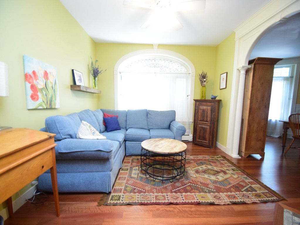 17 Strathmore Road, Unit 1 Brookline, MA 02445 - Photo 2 of 19 a living room with furniture and a rug