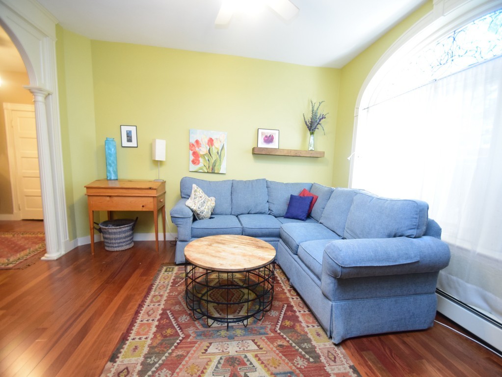 17 Strathmore Road, Unit 1 Brookline, MA 02445 - Photo 5 of 19 a living room with furniture and a fireplace