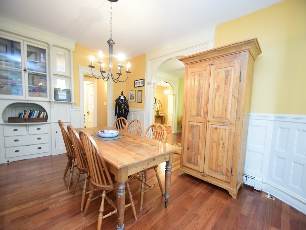 17 Strathmore Road, Unit 1 Brookline, MA 02445 - Photo 6 of 19 a view of a dining room with furniture window and wooden floor