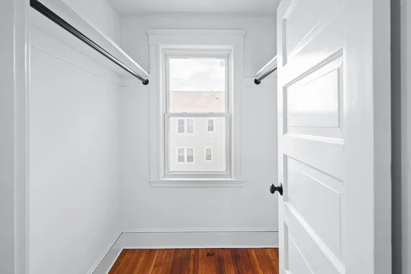 a view of a room that has a window in it