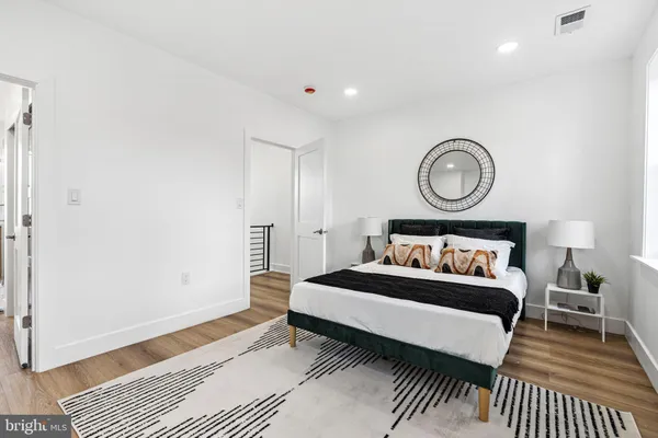 a bedroom with a bed and a table