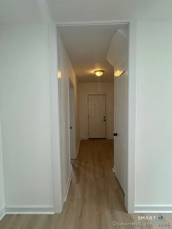 a view of a bathroom with wooden floor