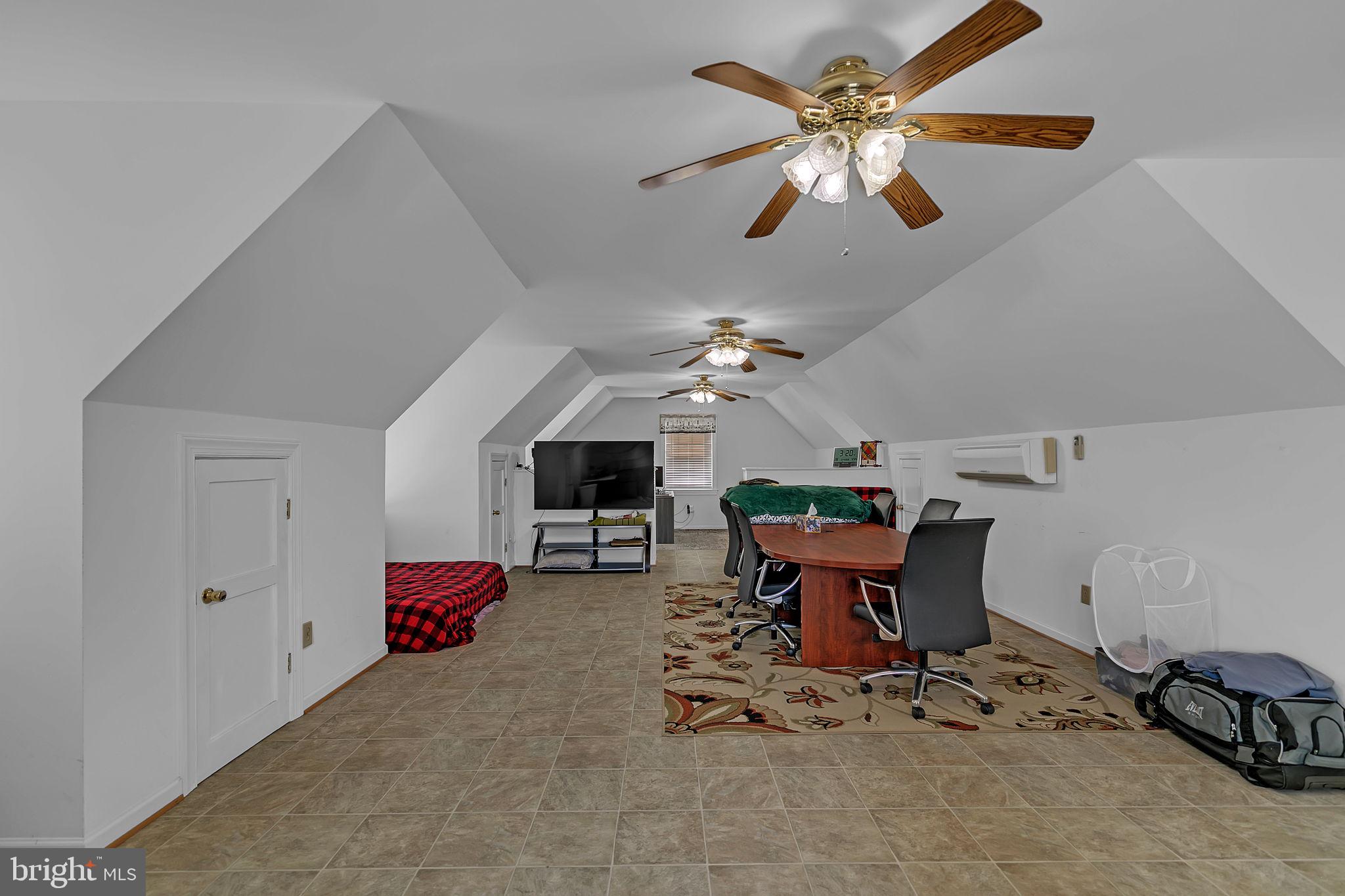 1887 Point Breeze Road Hudgins, VA 23076 - Photo 76 of 77 a living room with furniture a chandelier fan and a window