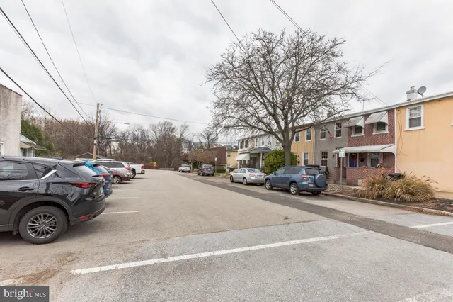 a view of street with parked cars