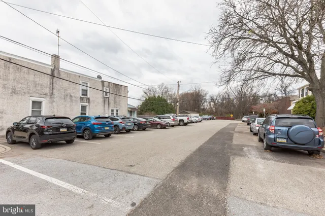 a view of street with parked cars