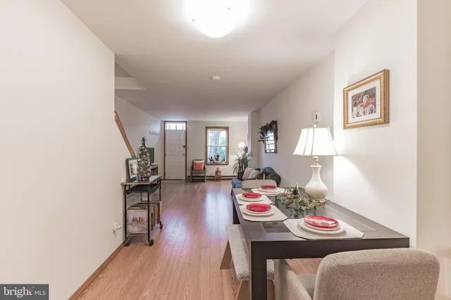 a view of a dining room with furniture and wooden floor