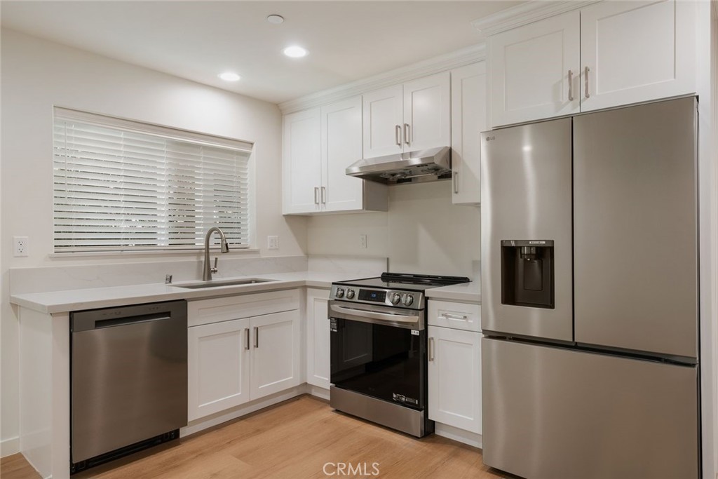 1806 South 8th Street, Unit B Alhambra, CA 91803 - Photo 18 of 44 a kitchen with a stove a refrigerator and a sink