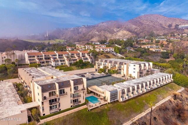 a view of city with tall buildings