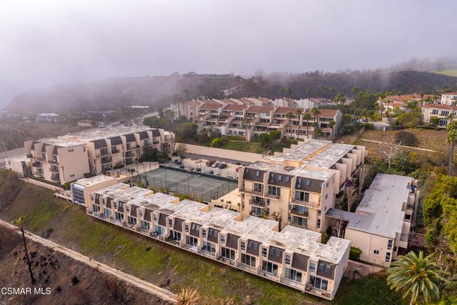 a view of a balcony with city view