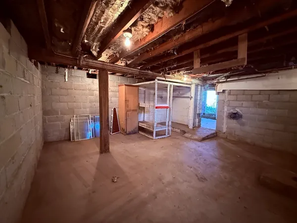 a view of empty room with wooden ceiling