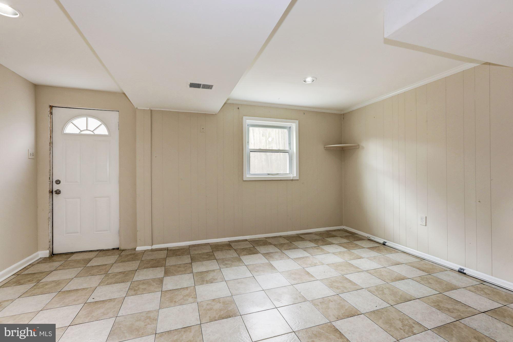 12409 Littleton Street Silver Spring, MD 20906 - Photo 19 of 31 a view of an empty room and window