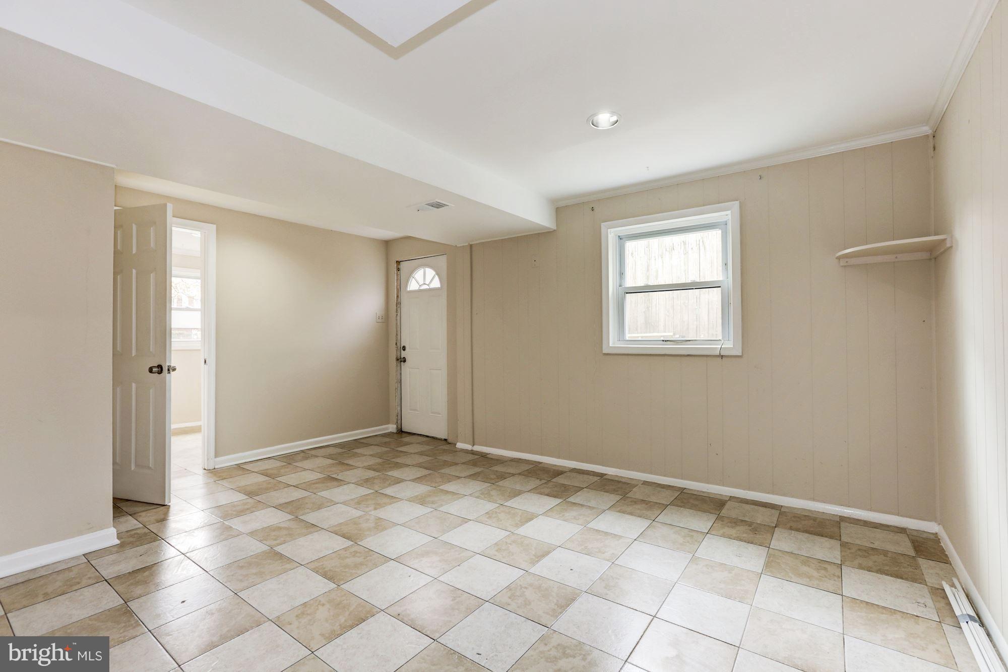 12409 Littleton Street Silver Spring, MD 20906 - Photo 20 of 31 a view of an empty room and window