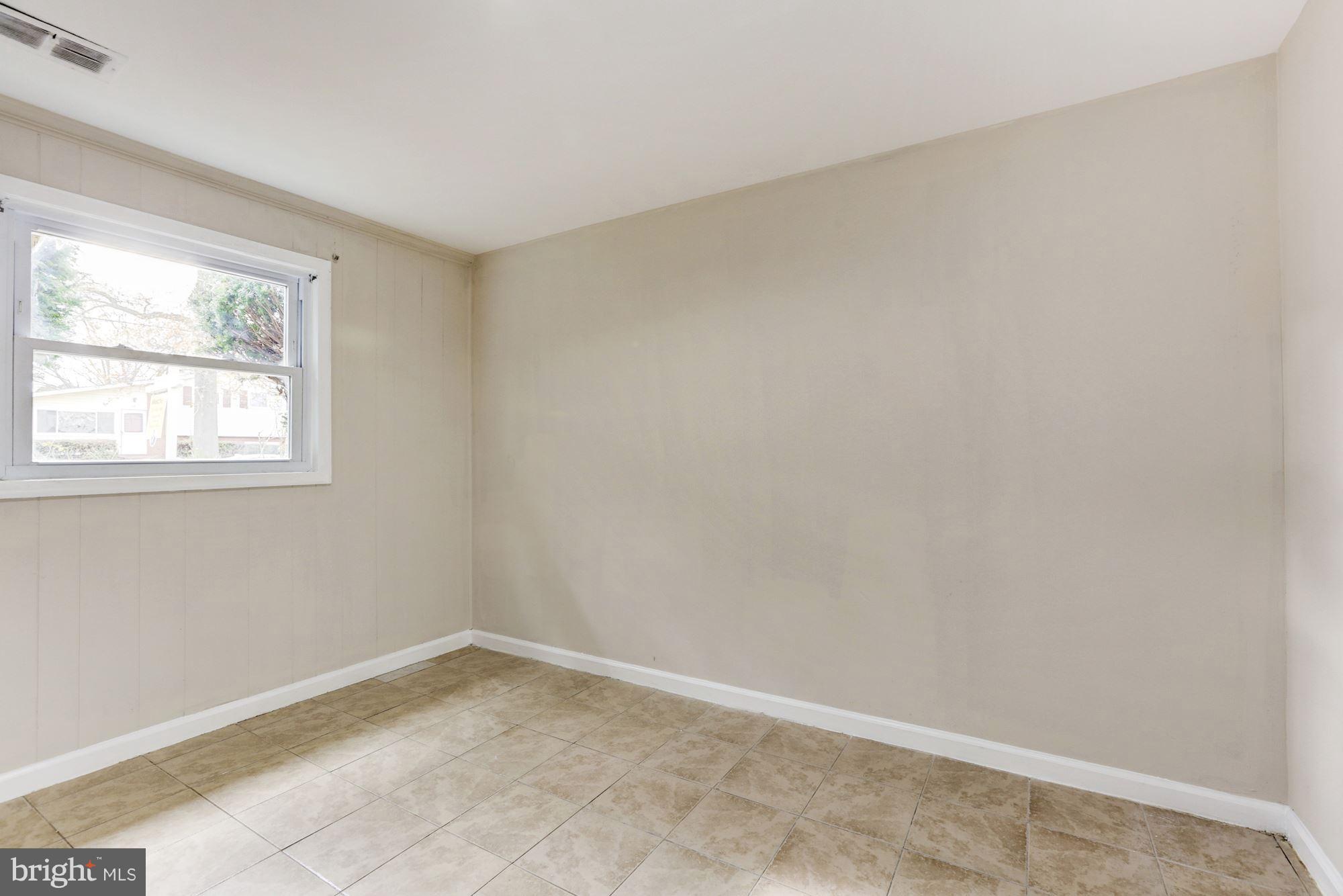 12409 Littleton Street Silver Spring, MD 20906 - Photo 22 of 31 an empty room with a window