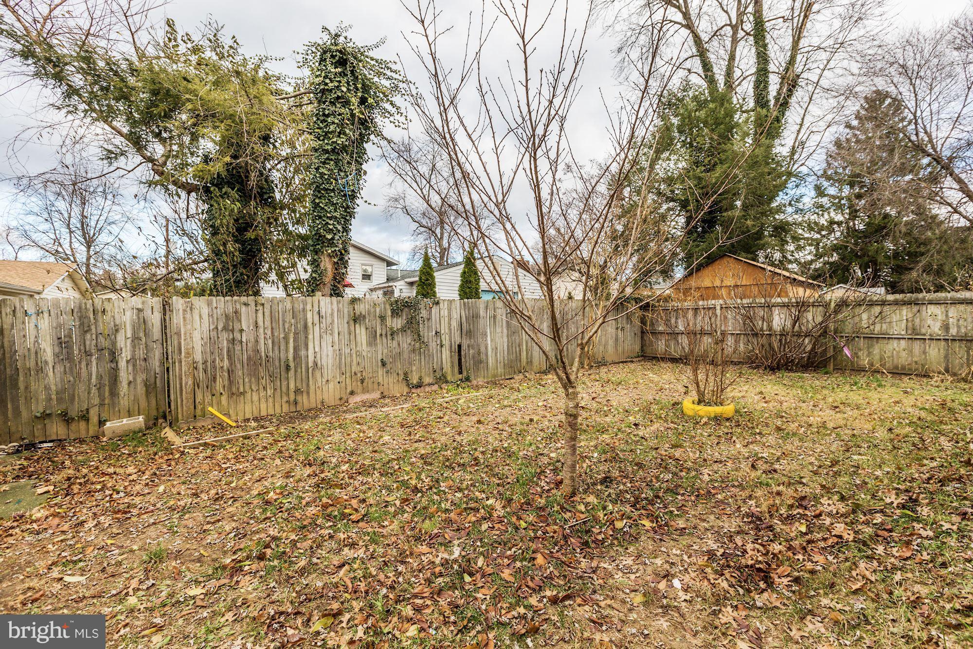 12409 Littleton Street Silver Spring, MD 20906 - Photo 27 of 31 a backyard of a house with wooden fence