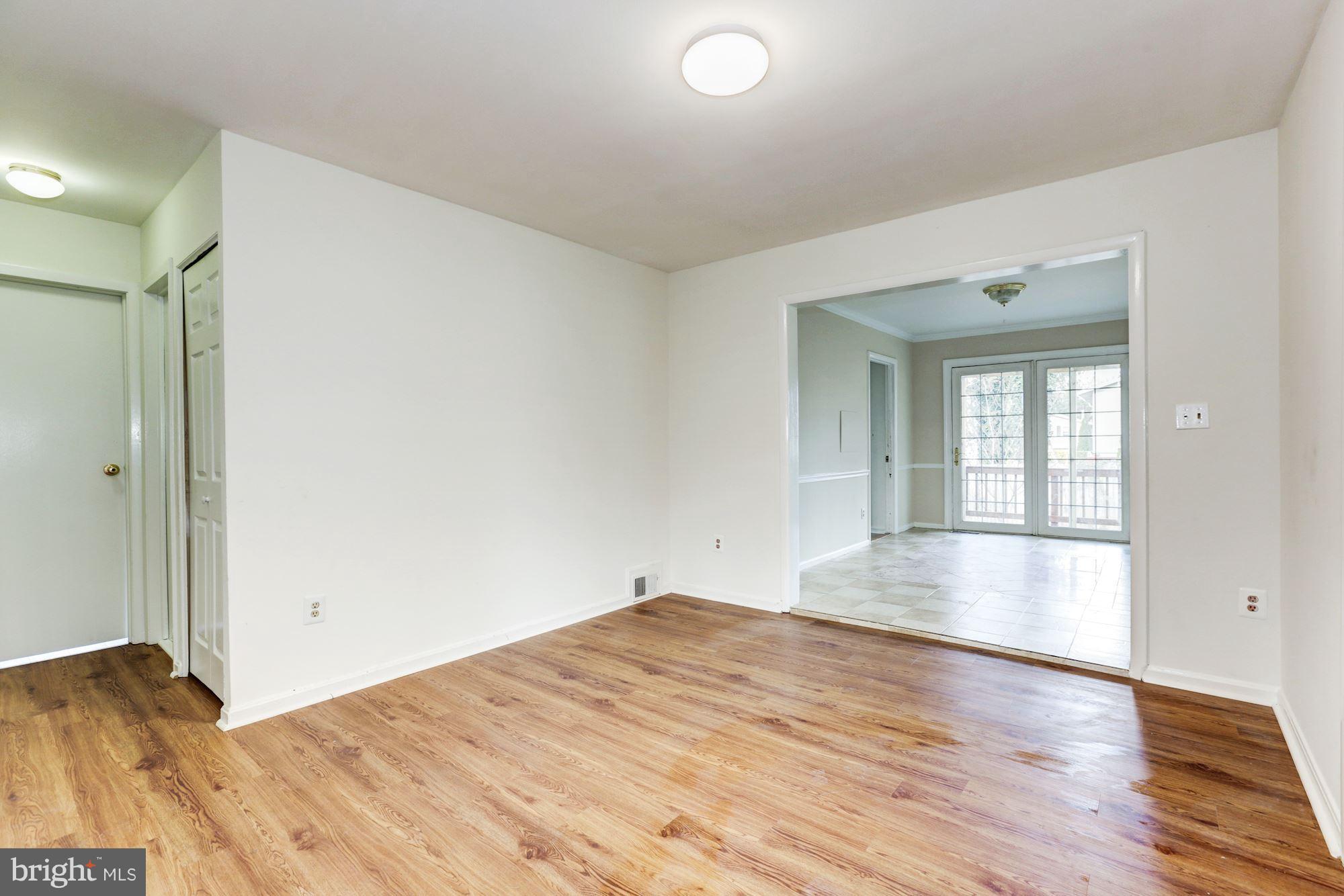 12409 Littleton Street Silver Spring, MD 20906 - Photo 6 of 31 a view of empty room with wooden floor and fan