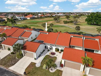 an aerial view of a house with a lake view