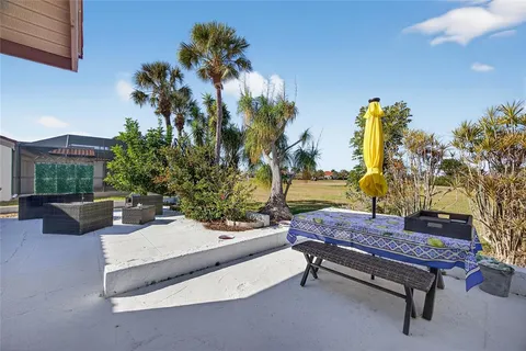 a view of a patio with a table and chairs