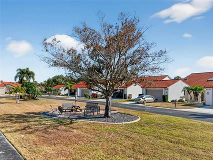a view of a swimming pool with an outdoor space and seating area
