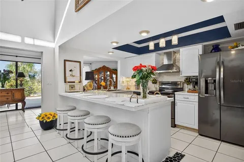 a kitchen with a refrigerator and cabinets
