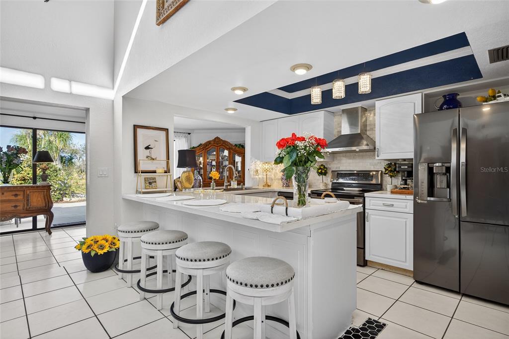 5061 San Rocco Court Punta Gorda, FL 33950 - Photo 8 of 32 a kitchen with a refrigerator and cabinets