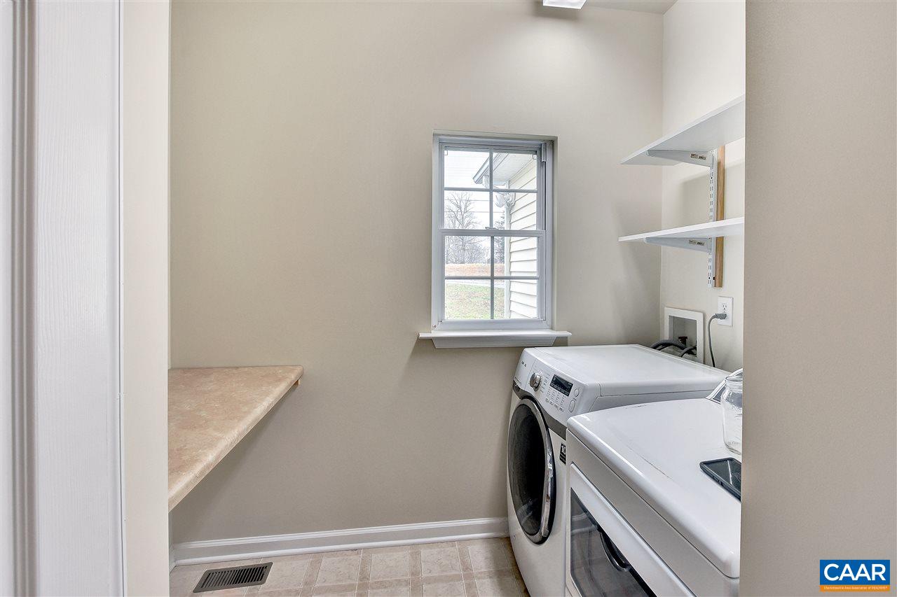 5875 Amicus Road Ruckersville, VA 22968 - Photo 18 of 31 a utility room with a window dryer and washer