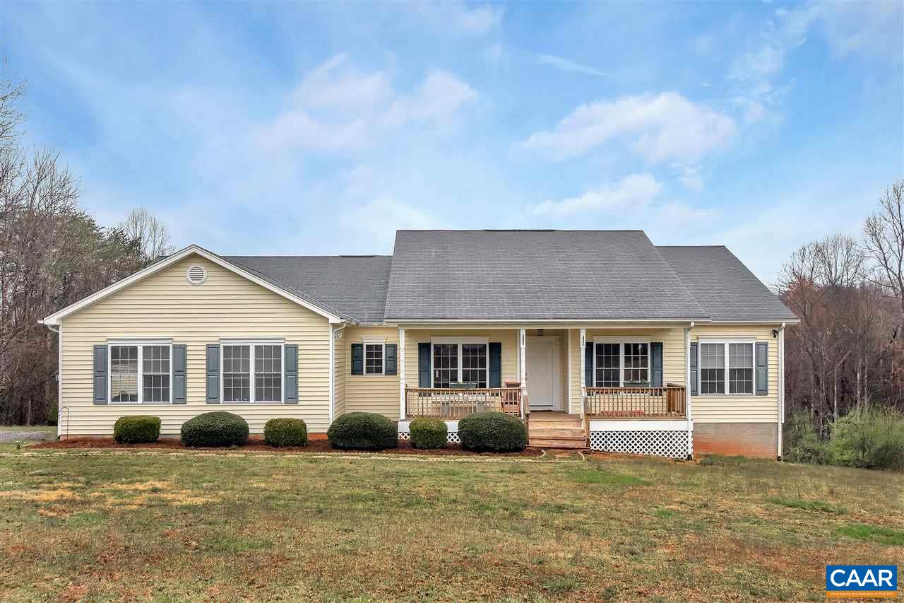 5875 Amicus Road Ruckersville, VA 22968 - Photo 2 of 31 a front view of a house with a garden