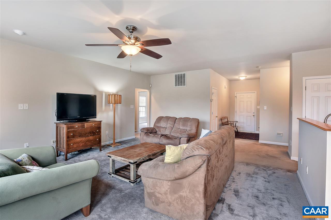 5875 Amicus Road Ruckersville, VA 22968 - Photo 3 of 31 a living room with furniture and a flat screen tv