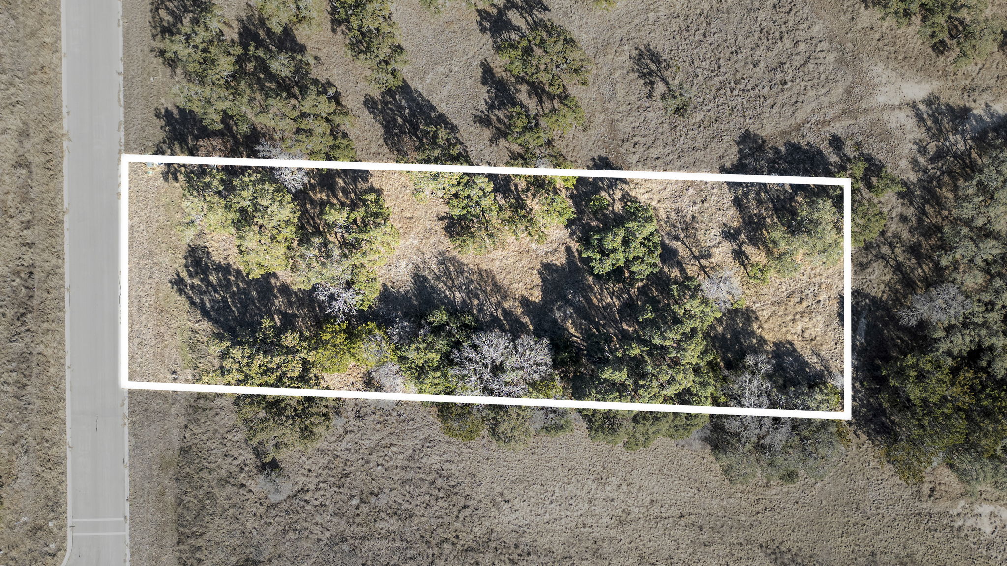 Aerial view of property and surrounding area with property boundaries highlighted