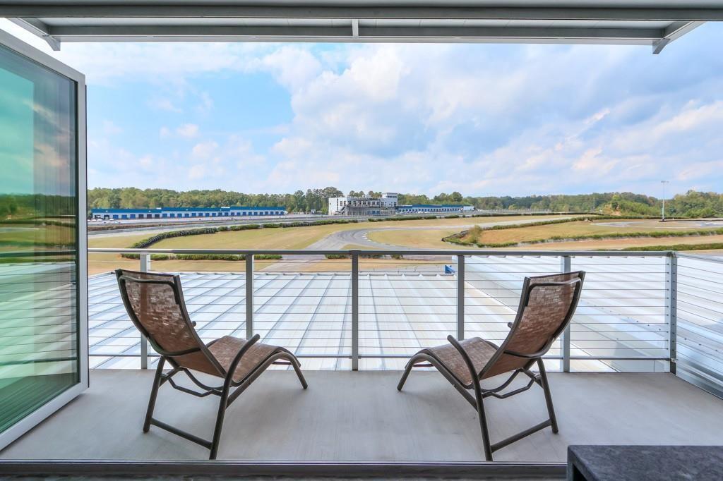 a view of chairs and table on the terrace