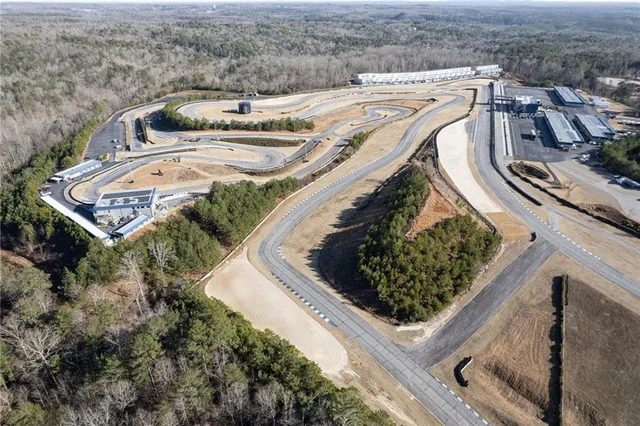 an aerial view of a house with outdoor space
