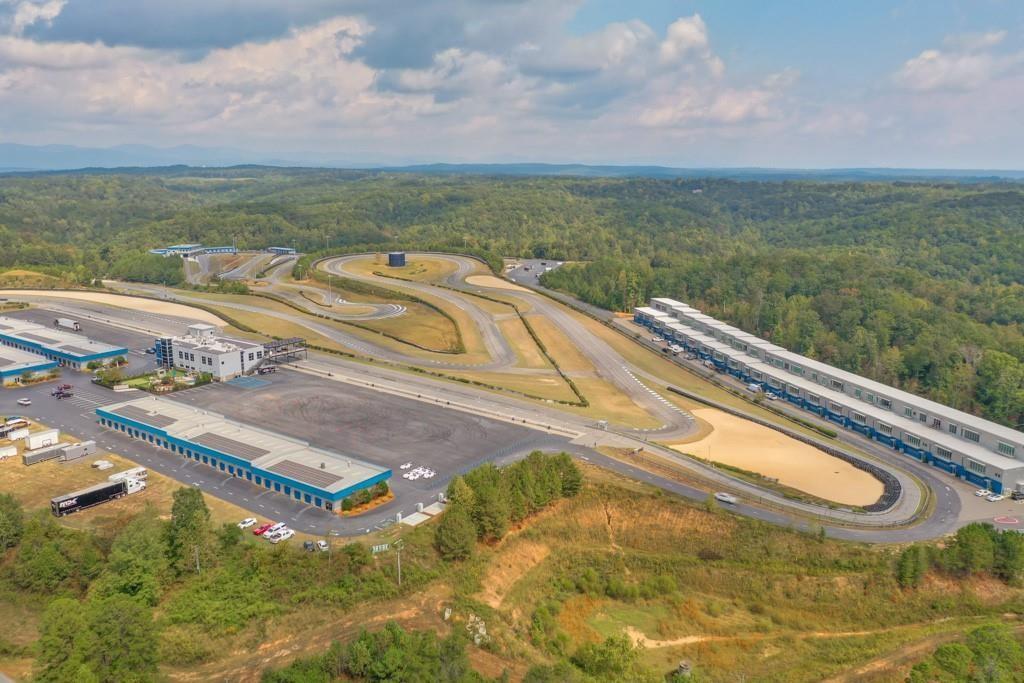 702 Joe Lane Cox Road, Unit 203 Dawsonville, GA 30534 - Photo 13 of 60 a view of a swimming pool with a terrace