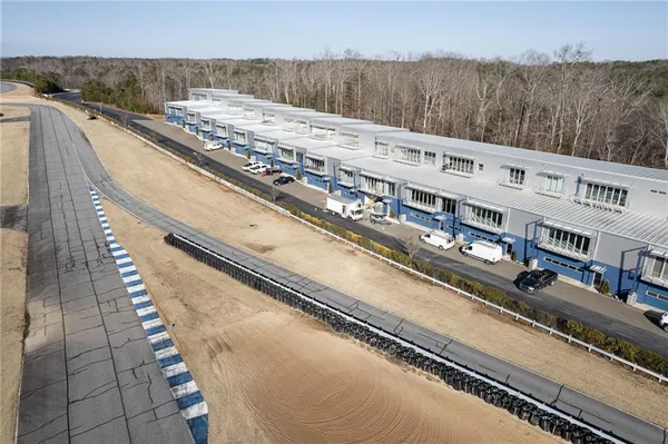 an aerial view of a house with outdoor space