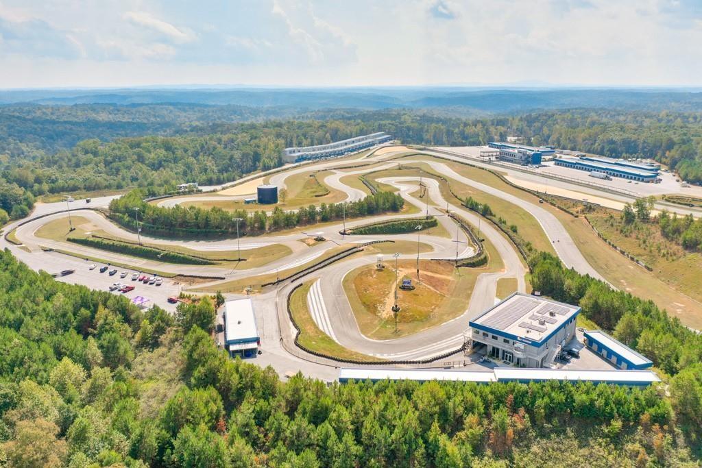 702 Joe Lane Cox Road, Unit 203 Dawsonville, GA 30534 - Photo 20 of 60 an aerial view of residential houses with outdoor space and river