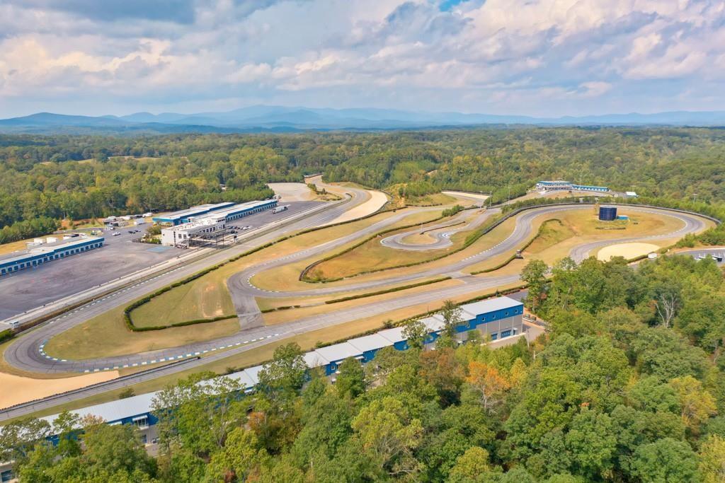 702 Joe Lane Cox Road, Unit 203 Dawsonville, GA 30534 - Photo 21 of 60 a view of a swimming pool with a lake view