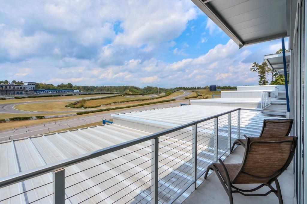 702 Joe Lane Cox Road, Unit 203 Dawsonville, GA 30534 - Photo 22 of 60 a view of swimming pool with outdoor seating