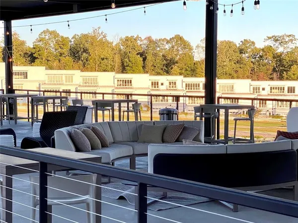 a view of a chairs and tables in the patio