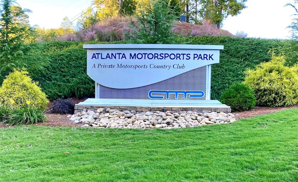 702 Joe Lane Cox Road, Unit 203 Dawsonville, GA 30534 - Photo 39 of 60 a sign on the side of the road