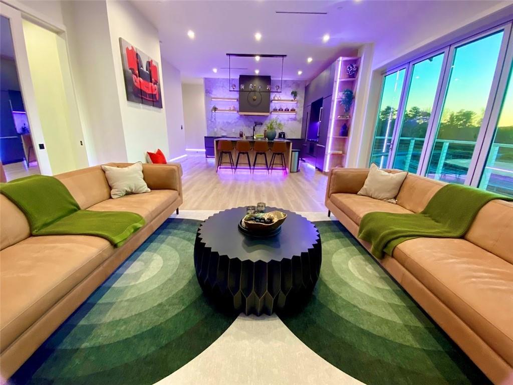 702 Joe Lane Cox Road, Unit 203 Dawsonville, GA 30534 - Photo 49 of 60 a living room with furniture and a large window