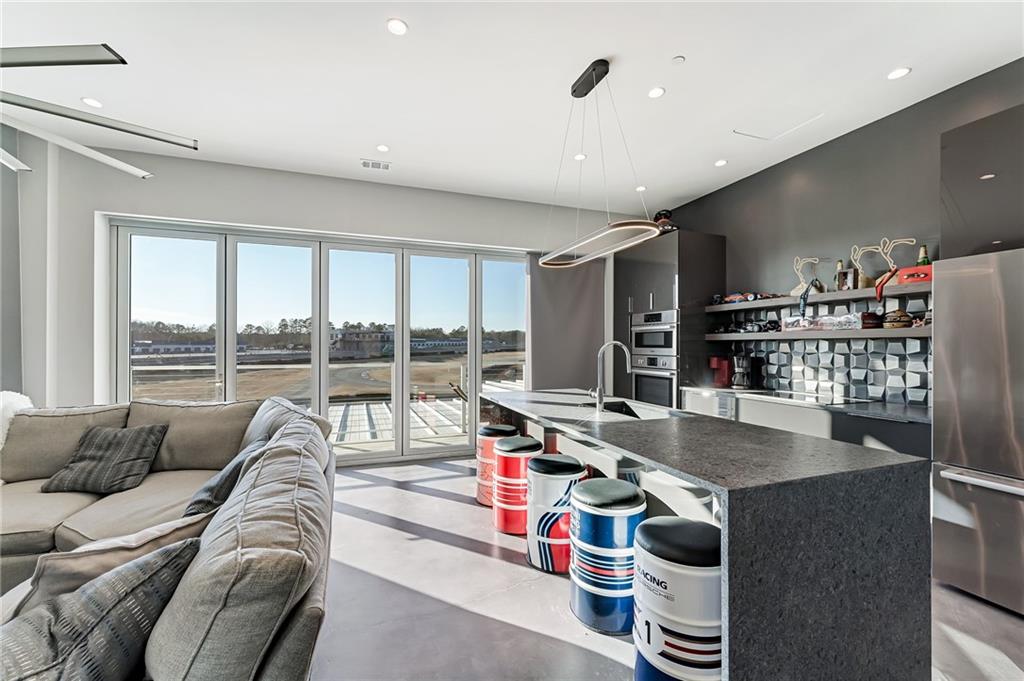 702 Joe Lane Cox Road, Unit 203 Dawsonville, GA 30534 - Photo 50 of 60 a living room with furniture and a large window